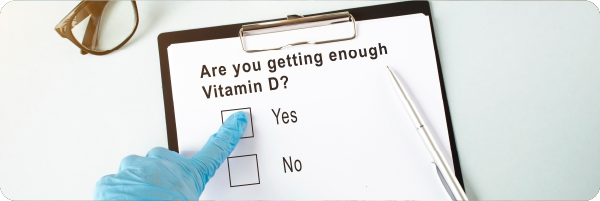 A piece of paper on a clipboard with text that reads: Are you getting enough Vitamin D followed by a check box for Yes and No.