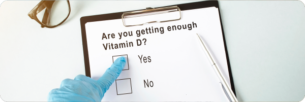 A clipboard with a piece of paper that says 'Are you getting enough vitamin D?' Yes or No.