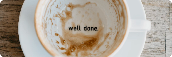Avoid caffeine in the afternoons for better sleep. Image shows a white coffee cup on a white saucer with the words 'well done' written on the bottom. 