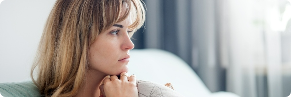 A young woman looking anxious or depressed. 