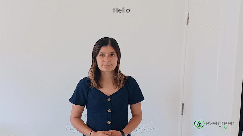 A GIF of Evergreen Life Content Writer, Jayna Shepherd signing the words 'Hello' and 'Goodbye' in British Sign Language. The Evergreen Life logo can be seen in the bottom right hand corner. 