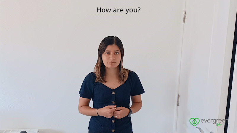 A GIF of Jayna Shepherd, Content Writer at Evergreen Life signing the question 'How are you?' in British Sign Language. The Evergreen Life logo is in the bottom right hand corner.  